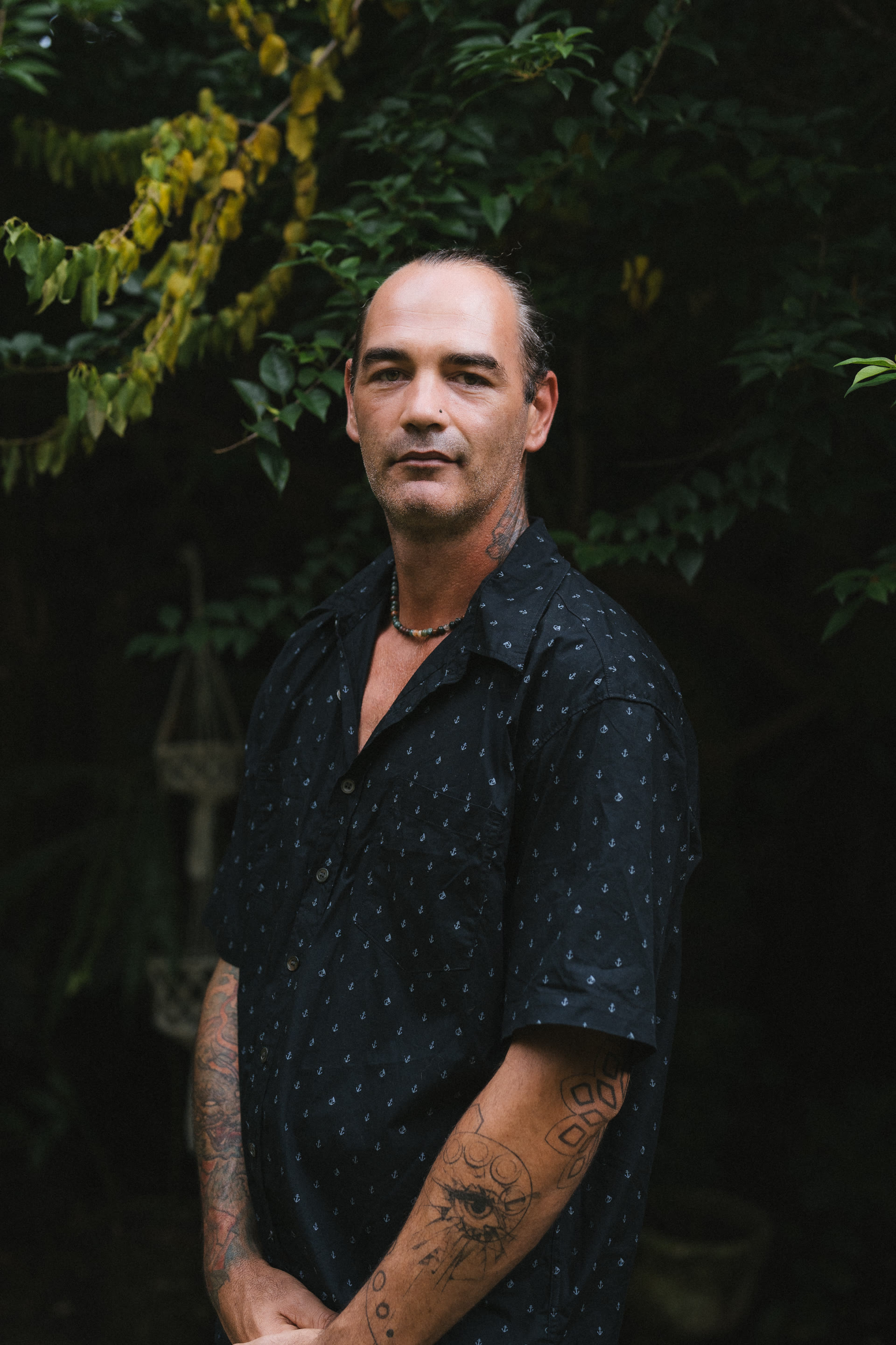 Kane Rawle standing beside the Peace of Eden clinic