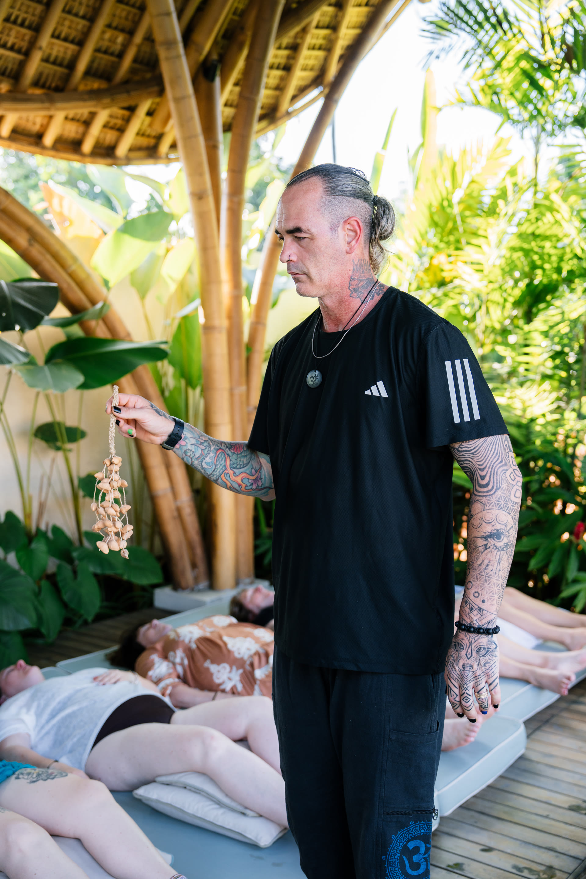 Kane holding koshi chimes over retreaters